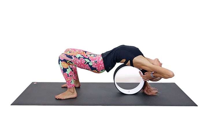 Yoga Wheel: 5 Ways to Use This Prop (Photo Tutorial)