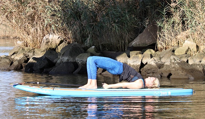 Paddleboard yoga students practice in the Kokomo Reservoir | Local news |  kokomotribune.com