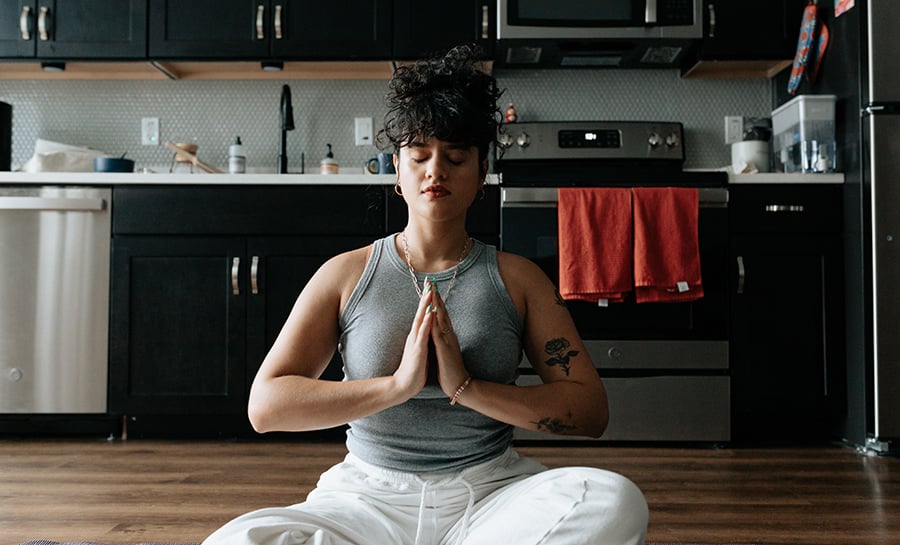 Premium Photo  Photo of a female doing yoga and meditation in front of  yellow color wall